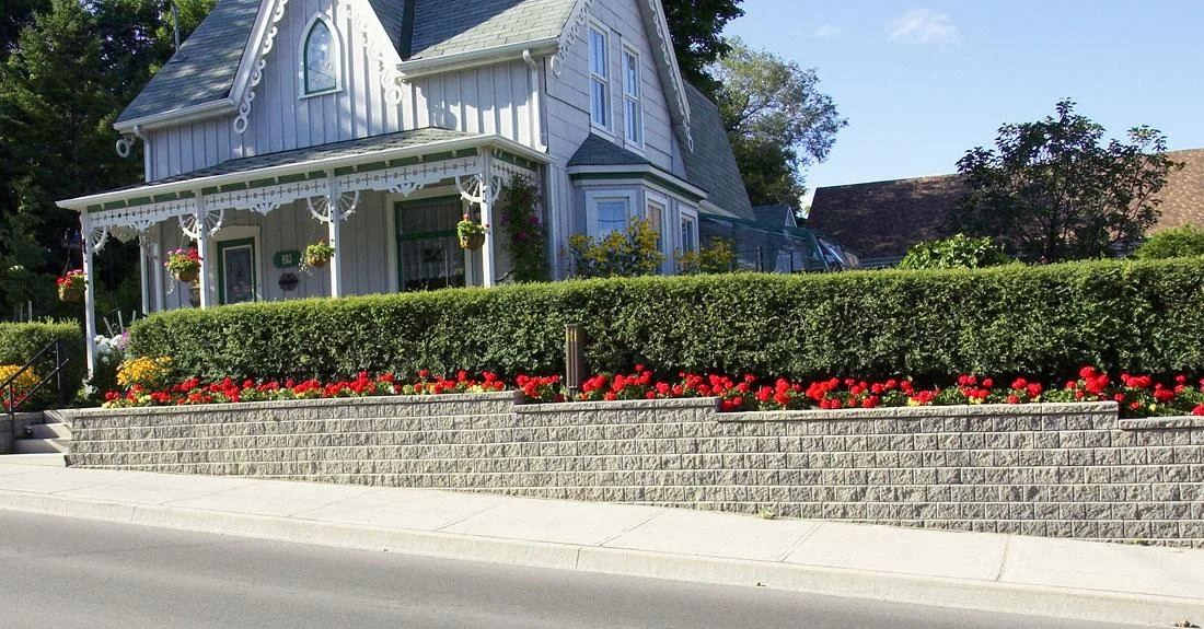 Interlocking retaining wall in Brampton designed and installed by KANU Interlocking with premium stone blocks