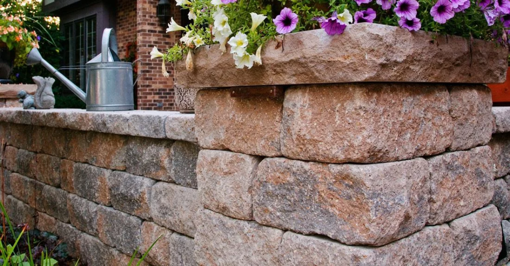 Interlocking retaining wall in Whitby designed and installed by KANU Interlocking with premium stone blocks