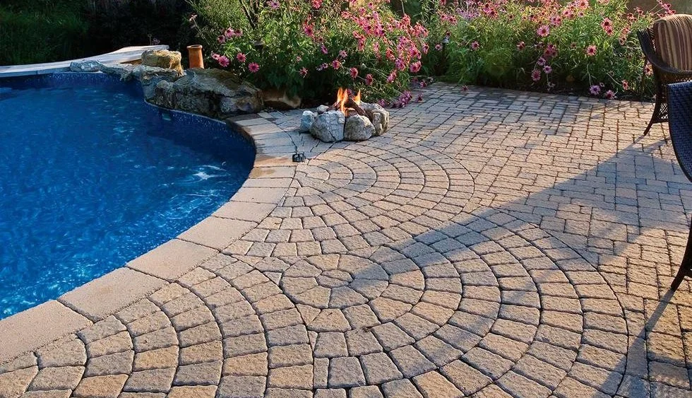 Custom interlocking poolside patio in Markham designed and installed by KANU Interlocking with high-quality stone pavers