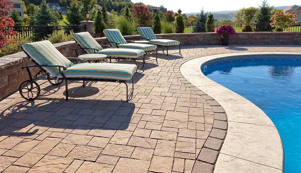 Custom interlocking poolside patio in Toronto designed and installed by KANU Interlocking with high-quality stone pavers