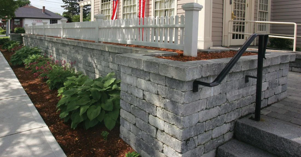 Interlocking retaining wall in Pickering designed and installed by KANU Interlocking with premium stone blocks
